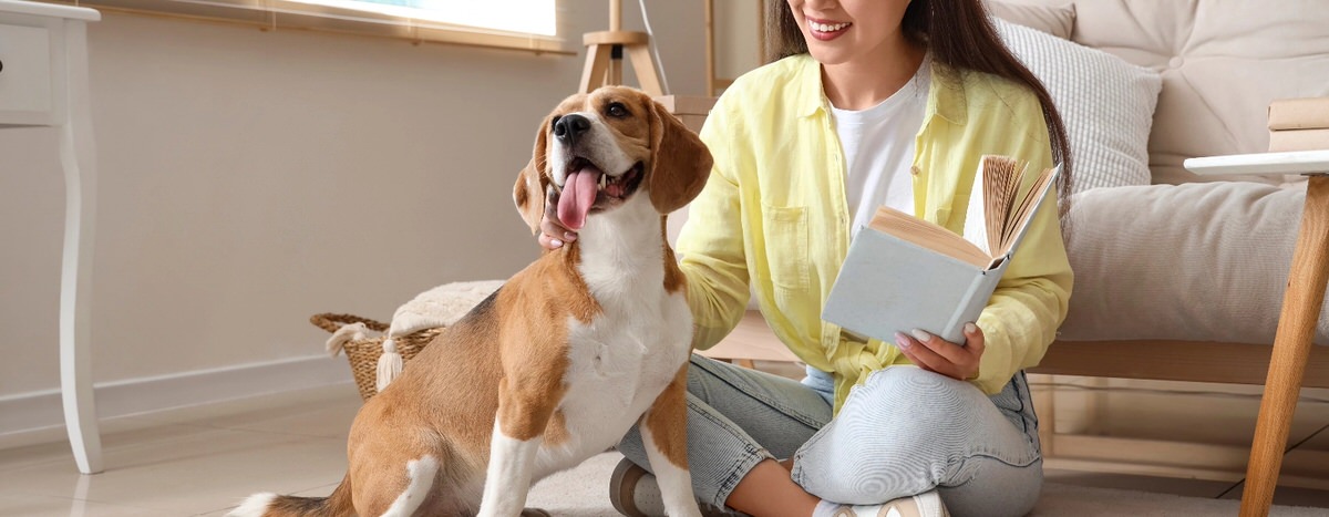 Dog and women sitting on the floor